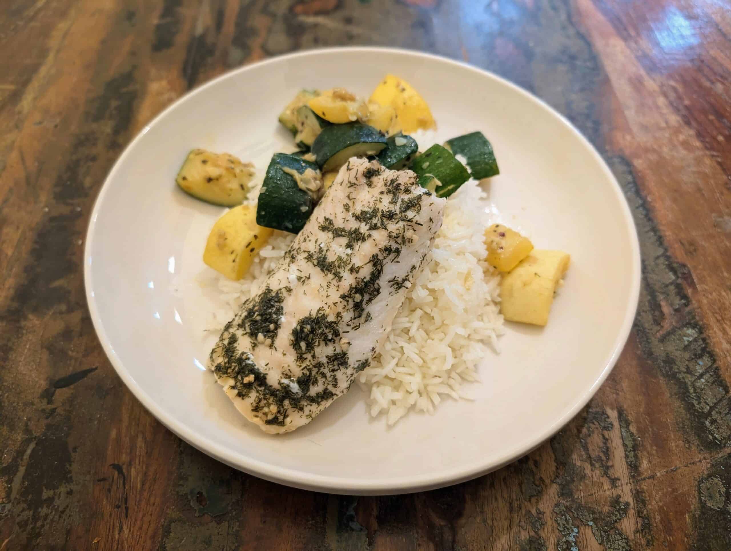 Buttery lemon cod, on a bed of rice, zucchini and squash