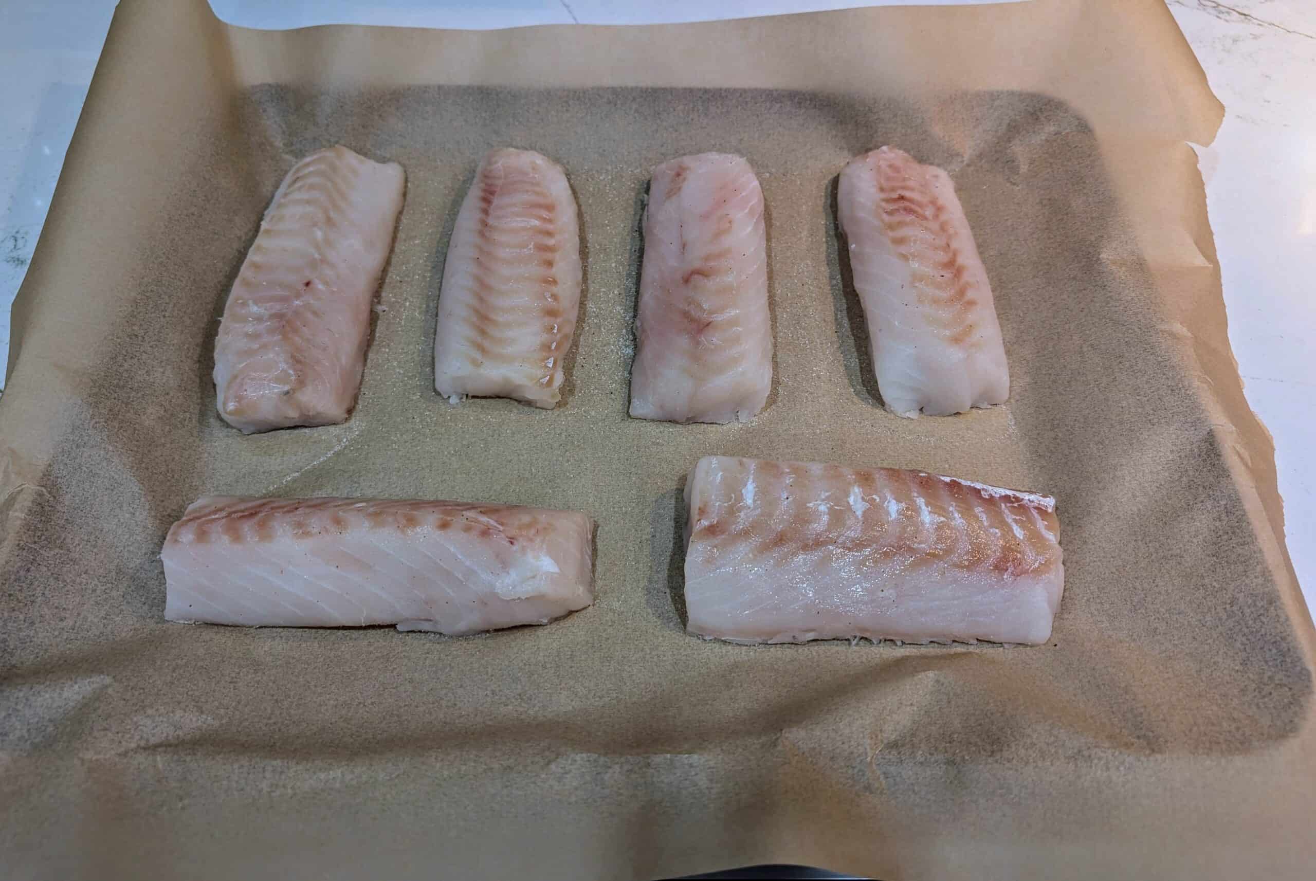 Cod on parchment paper, salted and coming to room temperature