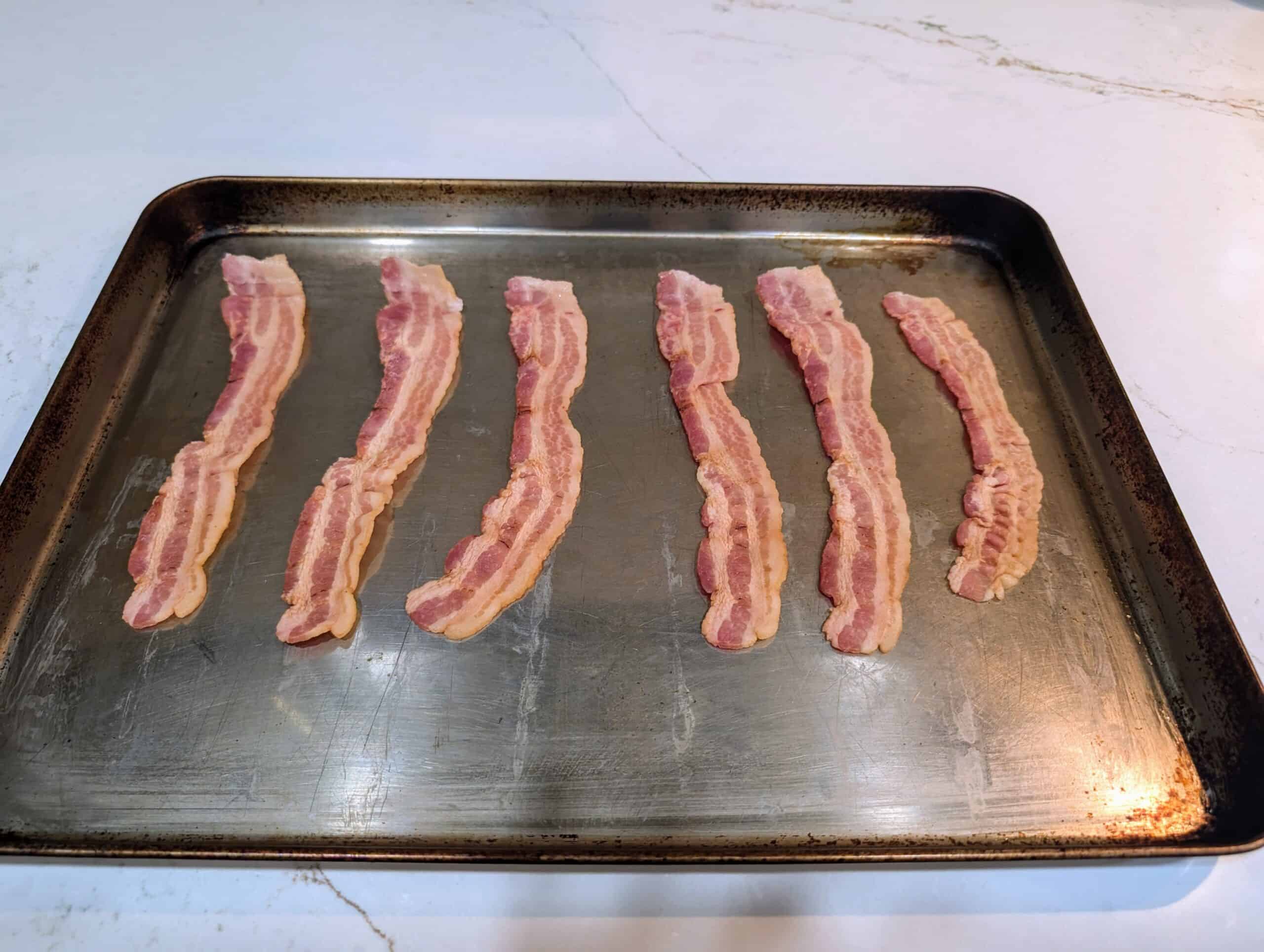 Bacon on a stainless steel cookie sheet