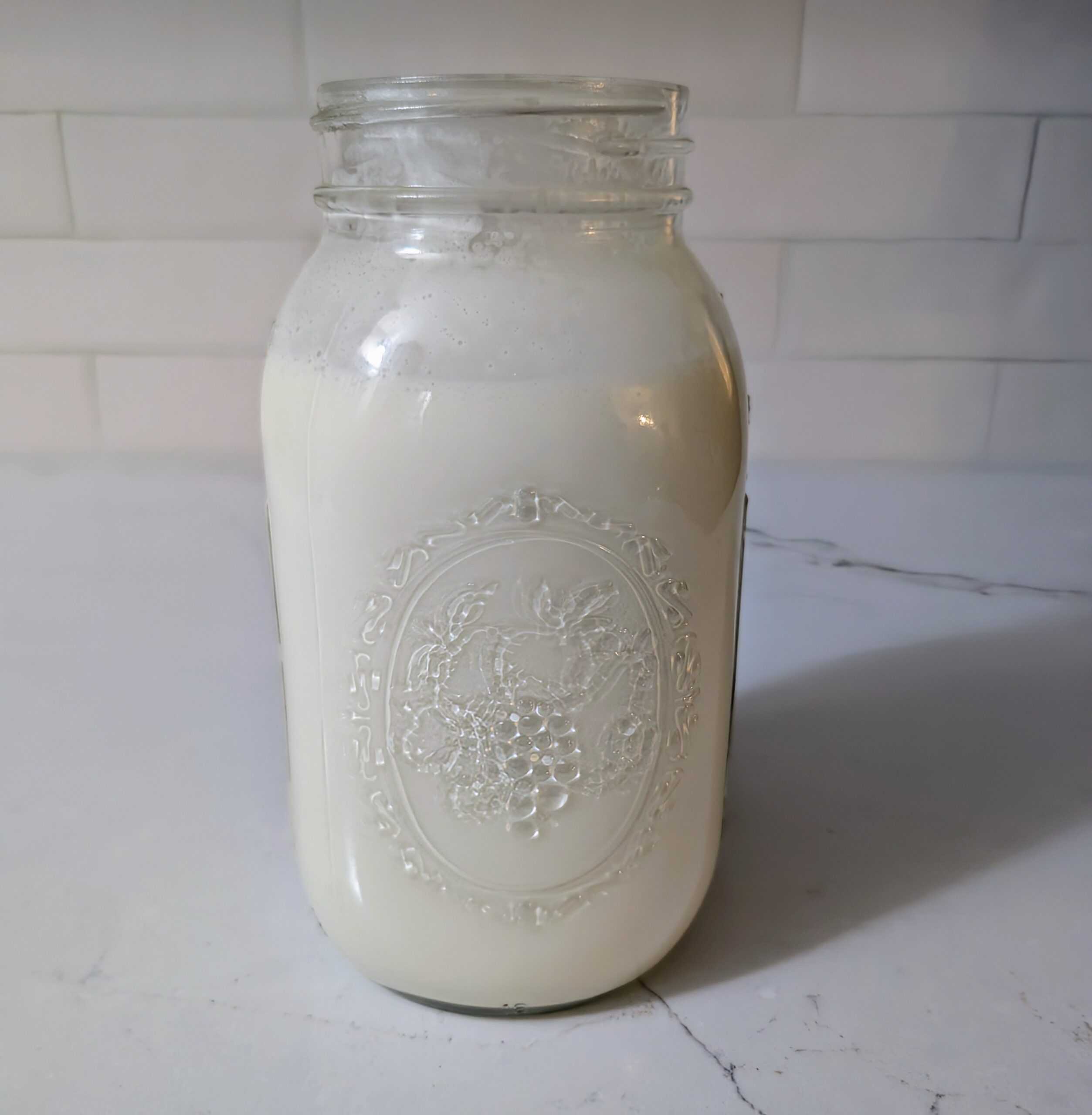 Dairy and vinegar added to mason jar 