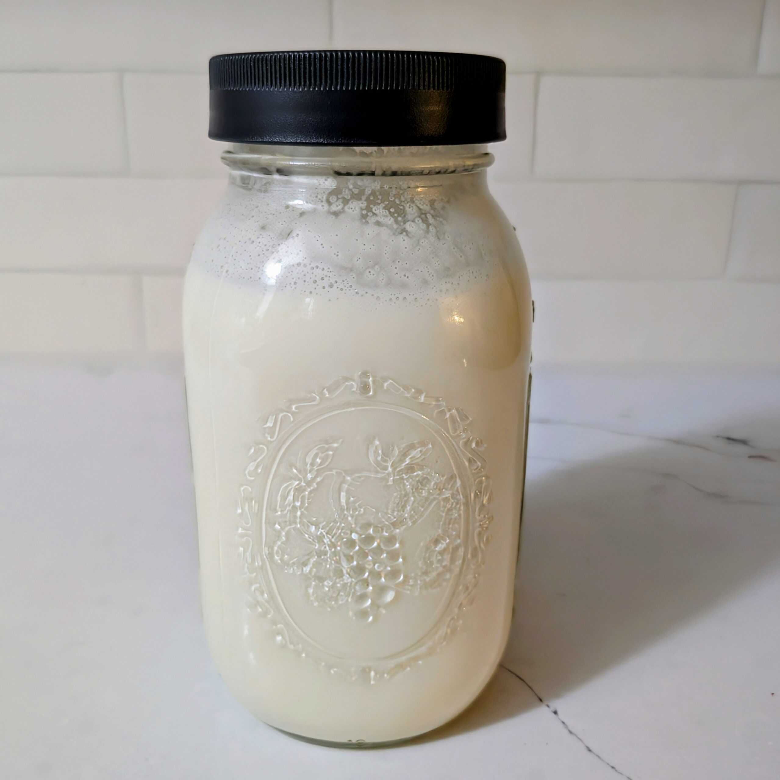 Dairy and vinegar sealed with air tight lid, ready to ferment for 24 hours on the counter